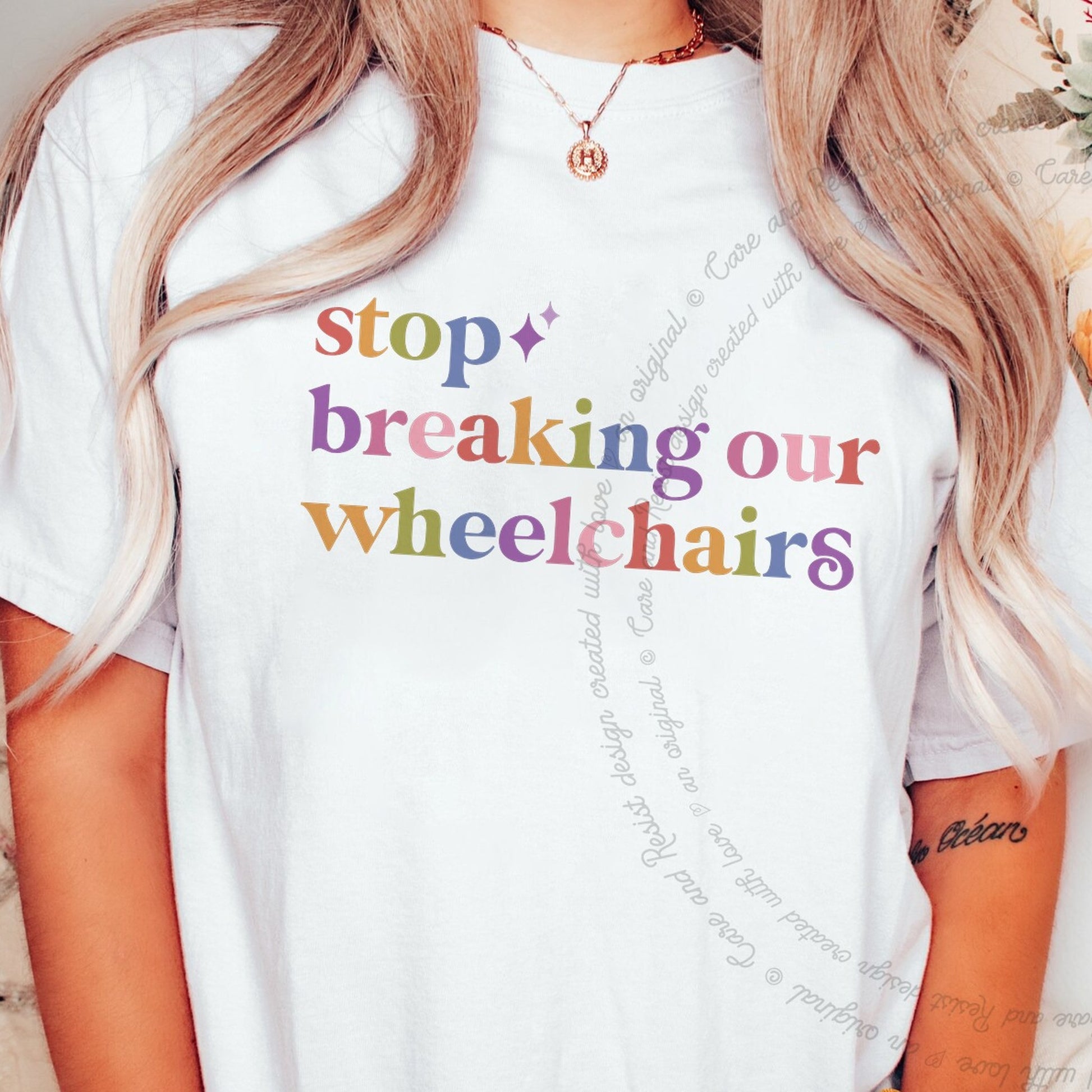 Stop Breaking Our Wheelchairs Care & Resist rainbow tee