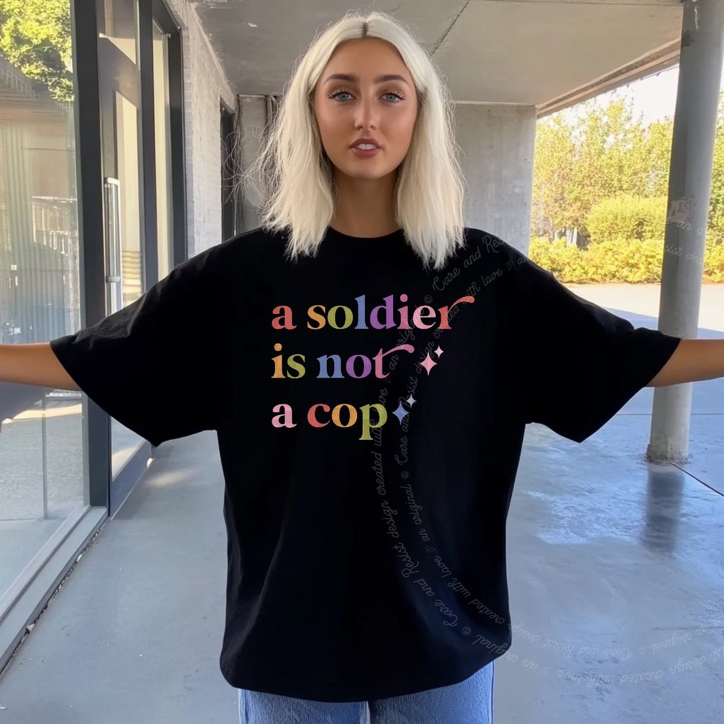 A Soldier is not a Cop Care & Resist rainbow tee