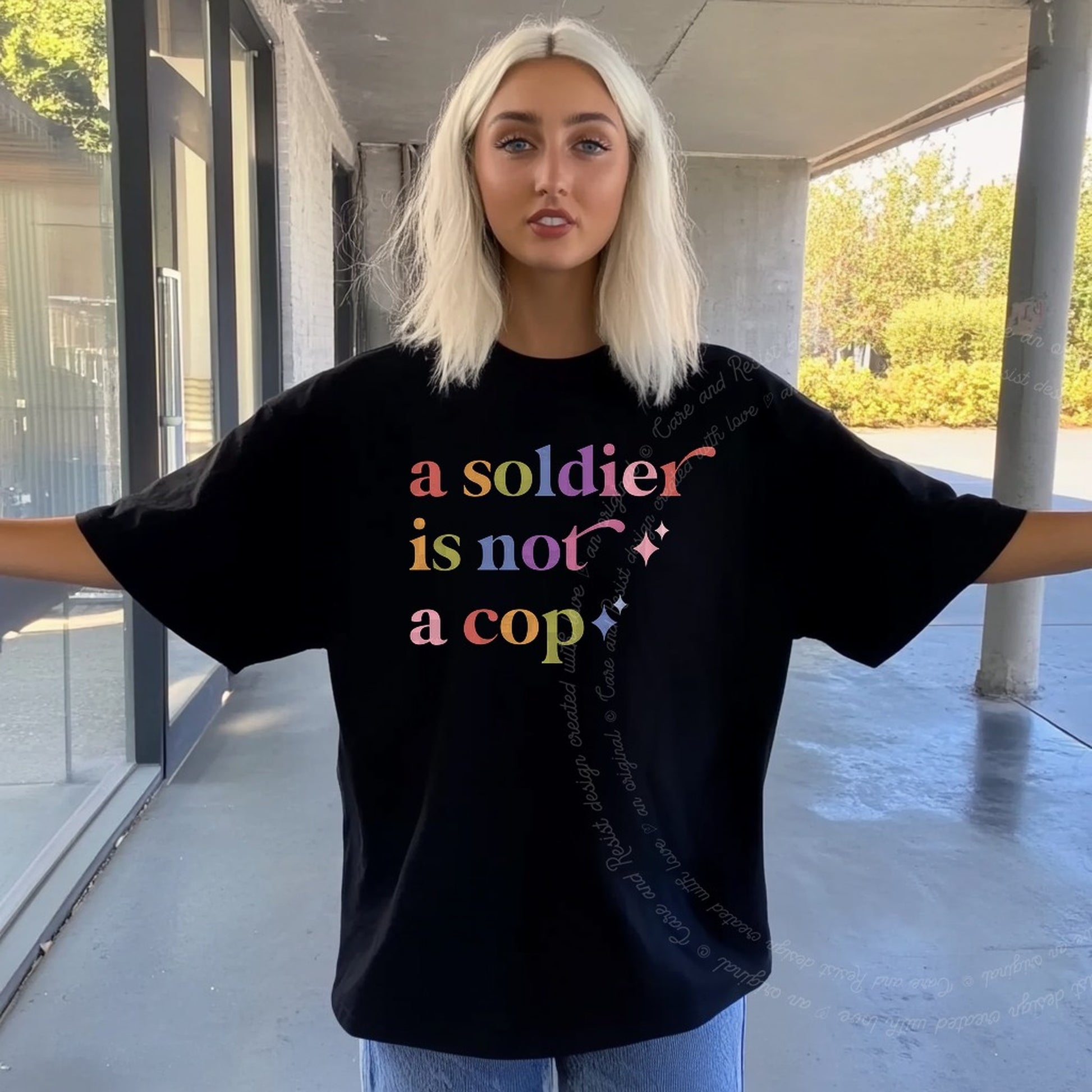 A Soldier is not a Cop Care & Resist rainbow tee