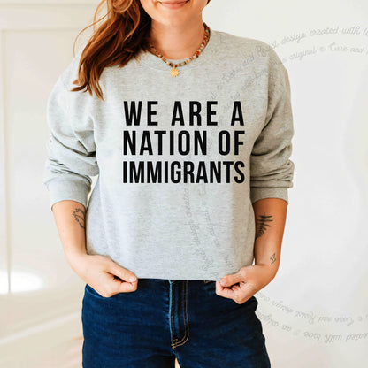We Are a Nation of Immigrants Care & Resist Gildan crewneck sweatshirt in Sport Grey