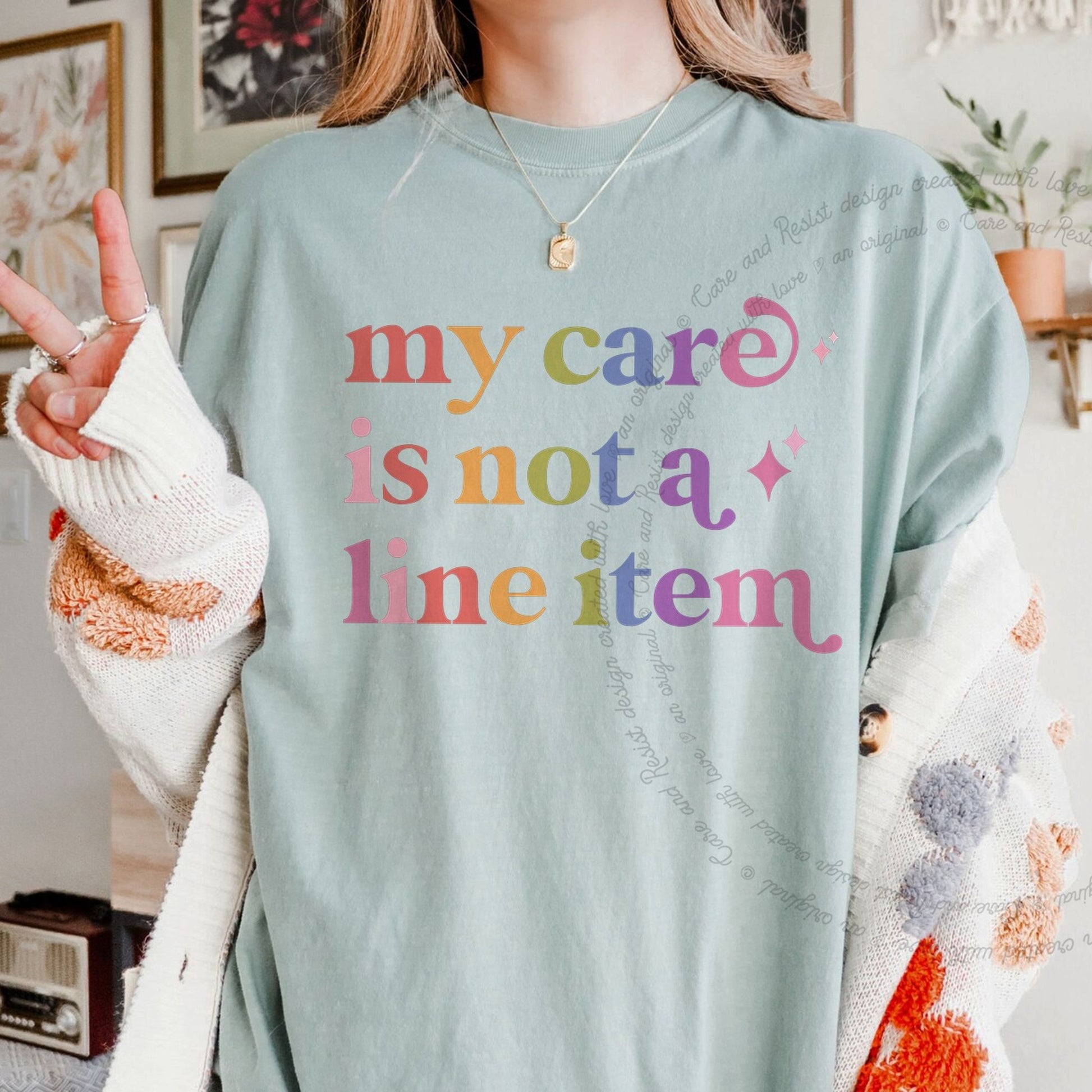 My Care is not a Line Item Care & Resist rainbow Comfort Colors tee, Bay