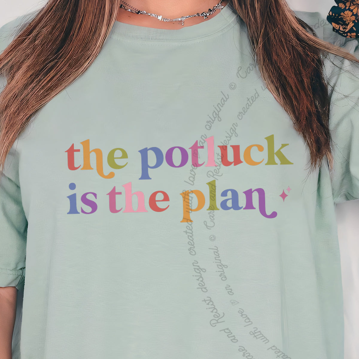 The Potluck is the Plan Care & Resist progressive t-shirt in Bay