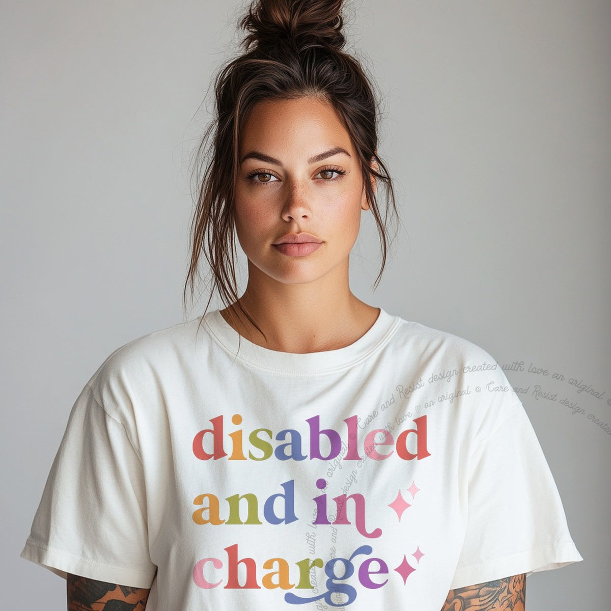Disabled and in Charge Care & Resist rainbow tee