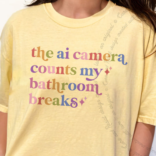 The Ai Camera Counts My Bathroom Breaks Care & Resist progressive t-shirt in Banana