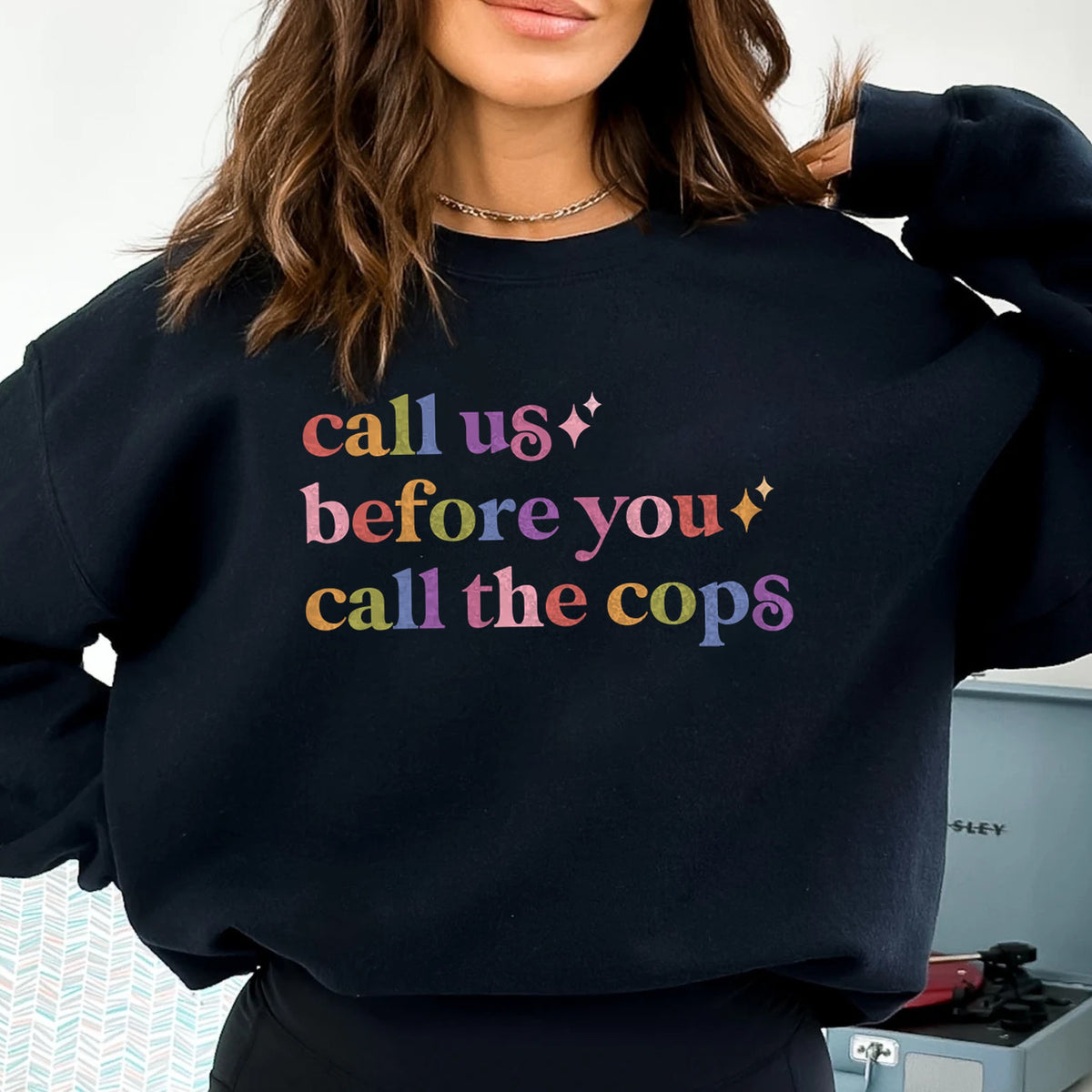 Call Us Before You Call the Cops Care & Resist Gildan crewneck sweatshirt in Black