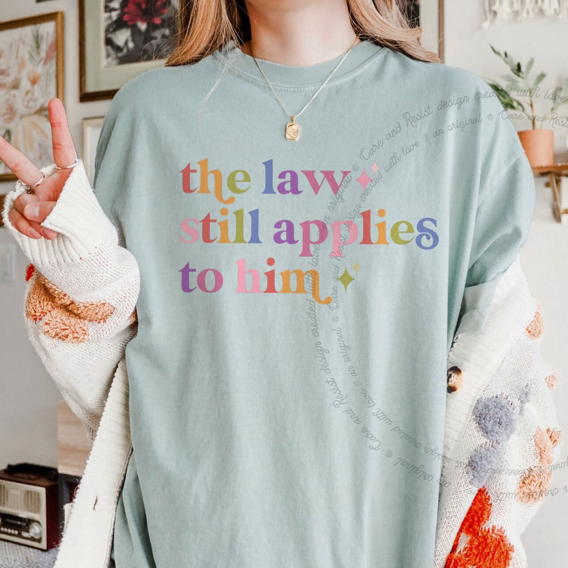 The Law Still Applies to Him Care & Resist rainbow Comfort Colors tee, Bay