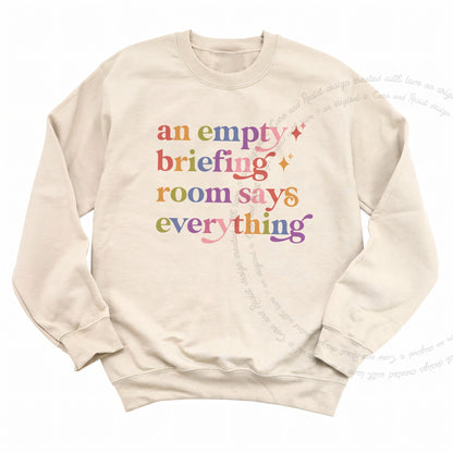 An Empty Briefing Room Says Everything Care & Resist Gildan crewneck sweatshirt in Sand