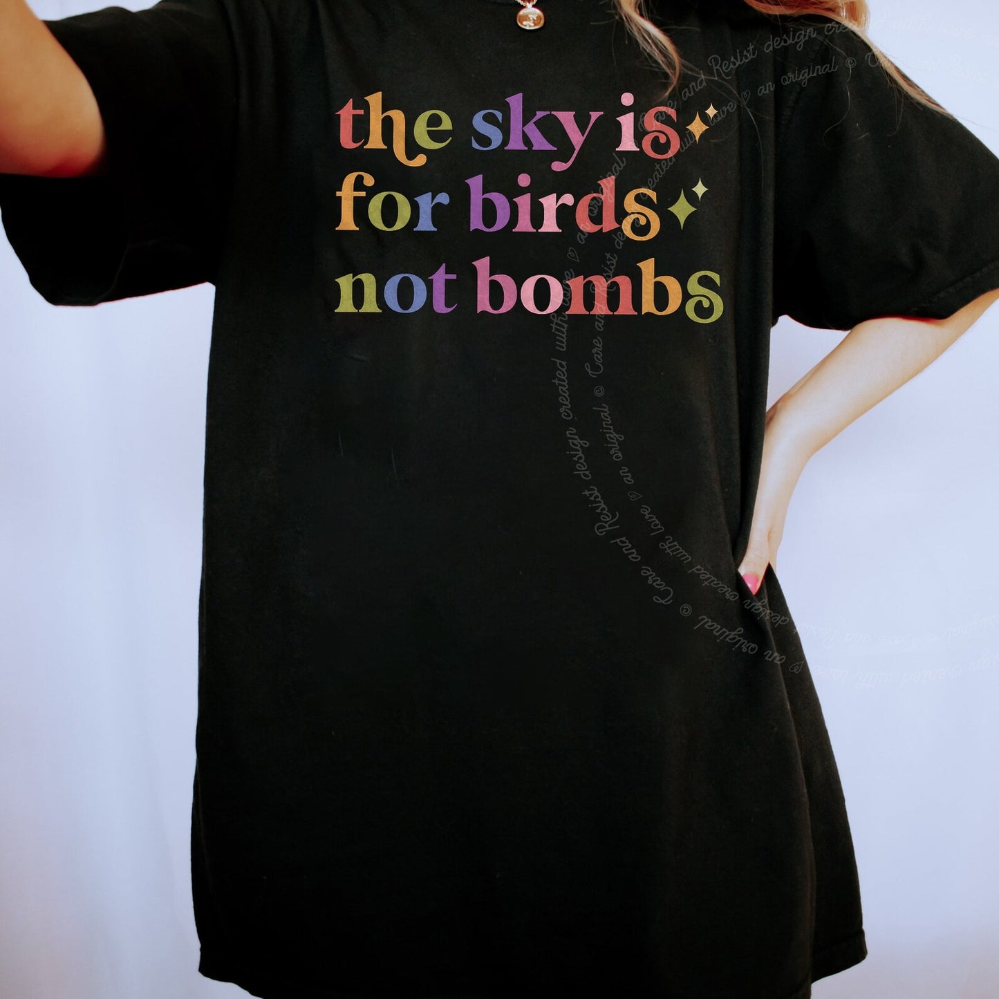 The Sky is for Birds not Bombs Care & Resist rainbow Comfort Colors tee, Black