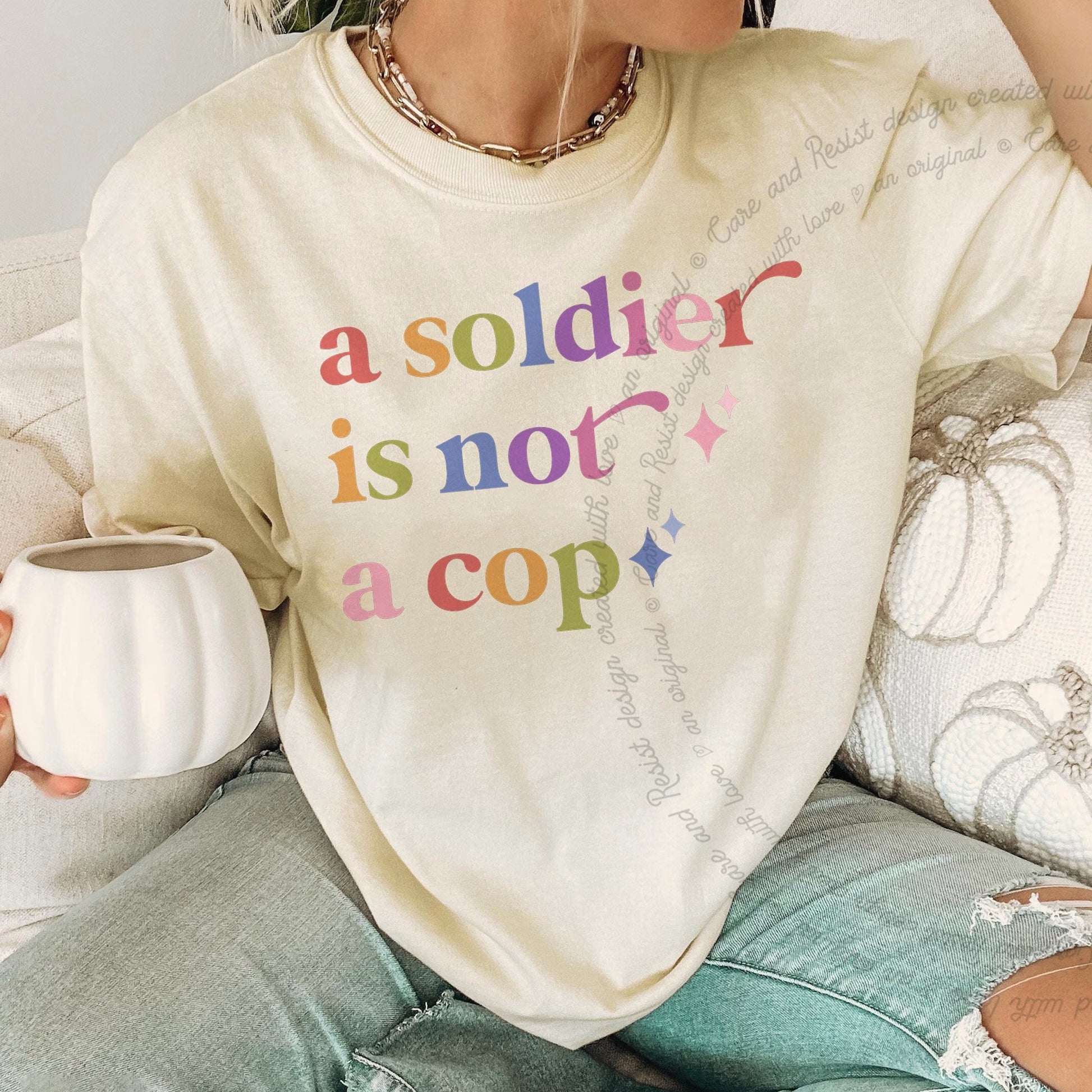A Soldier is not a Cop Care & Resist rainbow tee