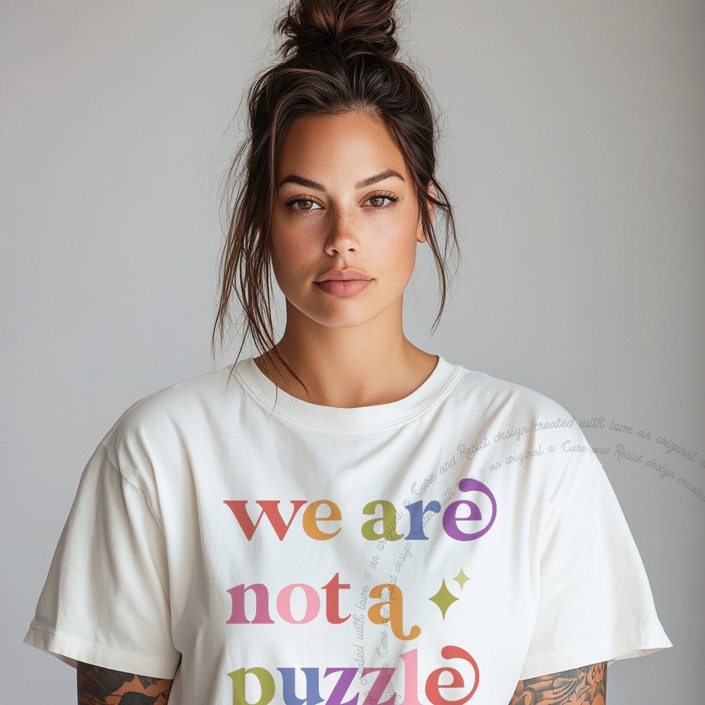 We are not a Puzzle Care & Resist rainbow tee