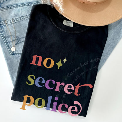 No Secret Police Care & Resist rainbow Comfort Colors tee, Black