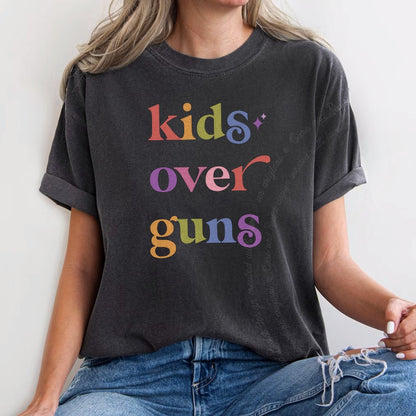 Kids Over Guns Care & Resist rainbow Comfort Colors tee, Graphite