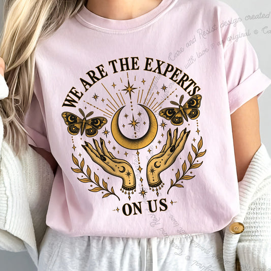 We are the Experts on Us Celestial Care & Resist progressive t-shirt in Blossom