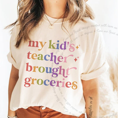 My Kid's Teacher Brought Groceries Care & Resist rainbow Comfort Colors tee, Ivory