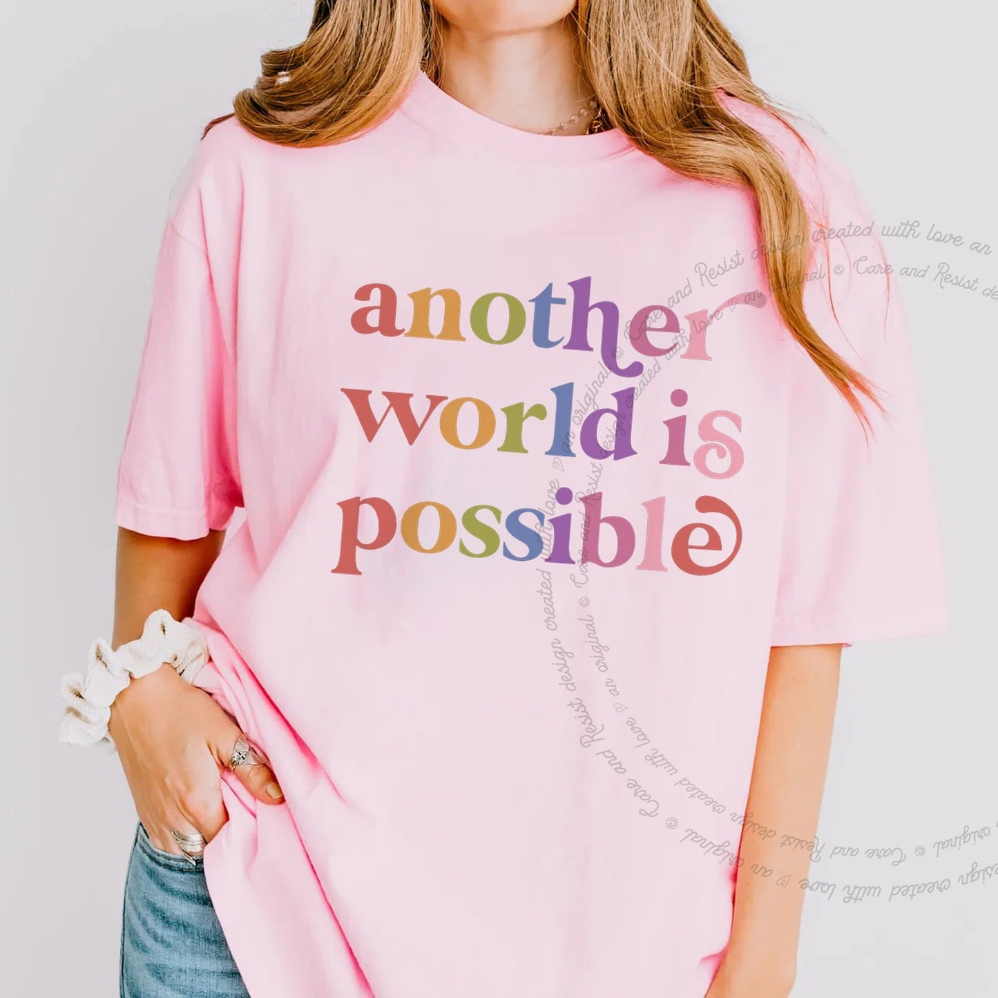 Another World is Possible Care & Resist rainbow Comfort Colors tee, Blossom