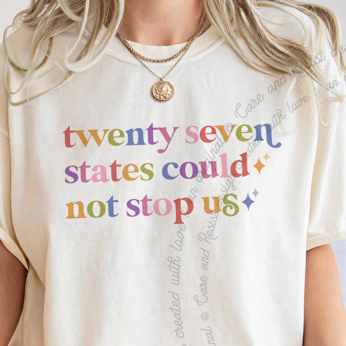 Twenty Seven States Could not Stop Us Care & Resist tee in Ivory, close-up of the lettering