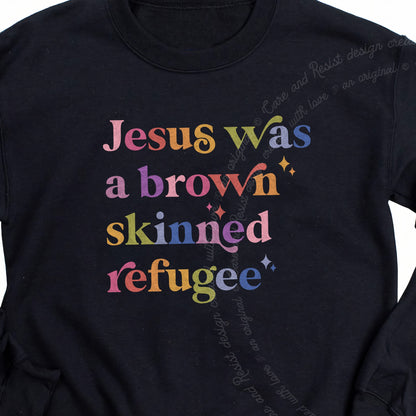 Jesus Was a Brown Skinned Refugee Care & Resist Gildan crewneck sweatshirt in Black
