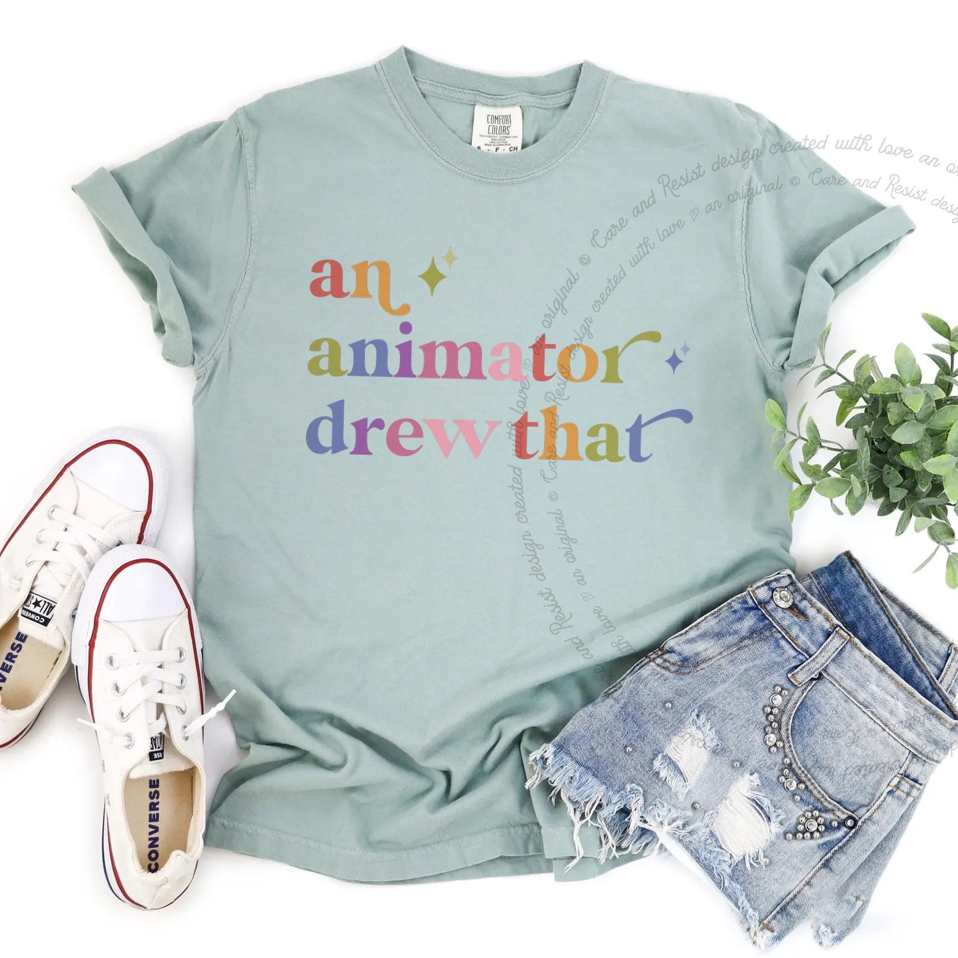 An Animator Drew That Care & Resist rainbow tee