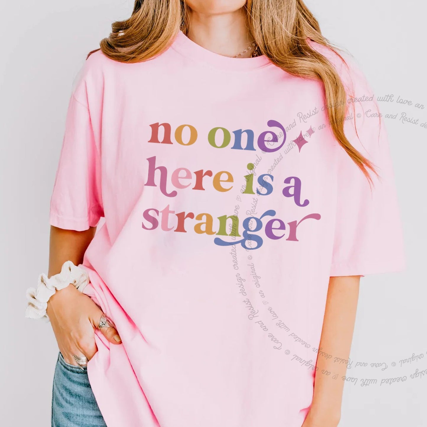 No One Here is a Stranger Care & Resist rainbow tee