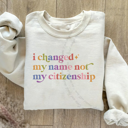 I Changed My Name not My Citizenship Care & Resist Gildan crewneck sweatshirt in Sand