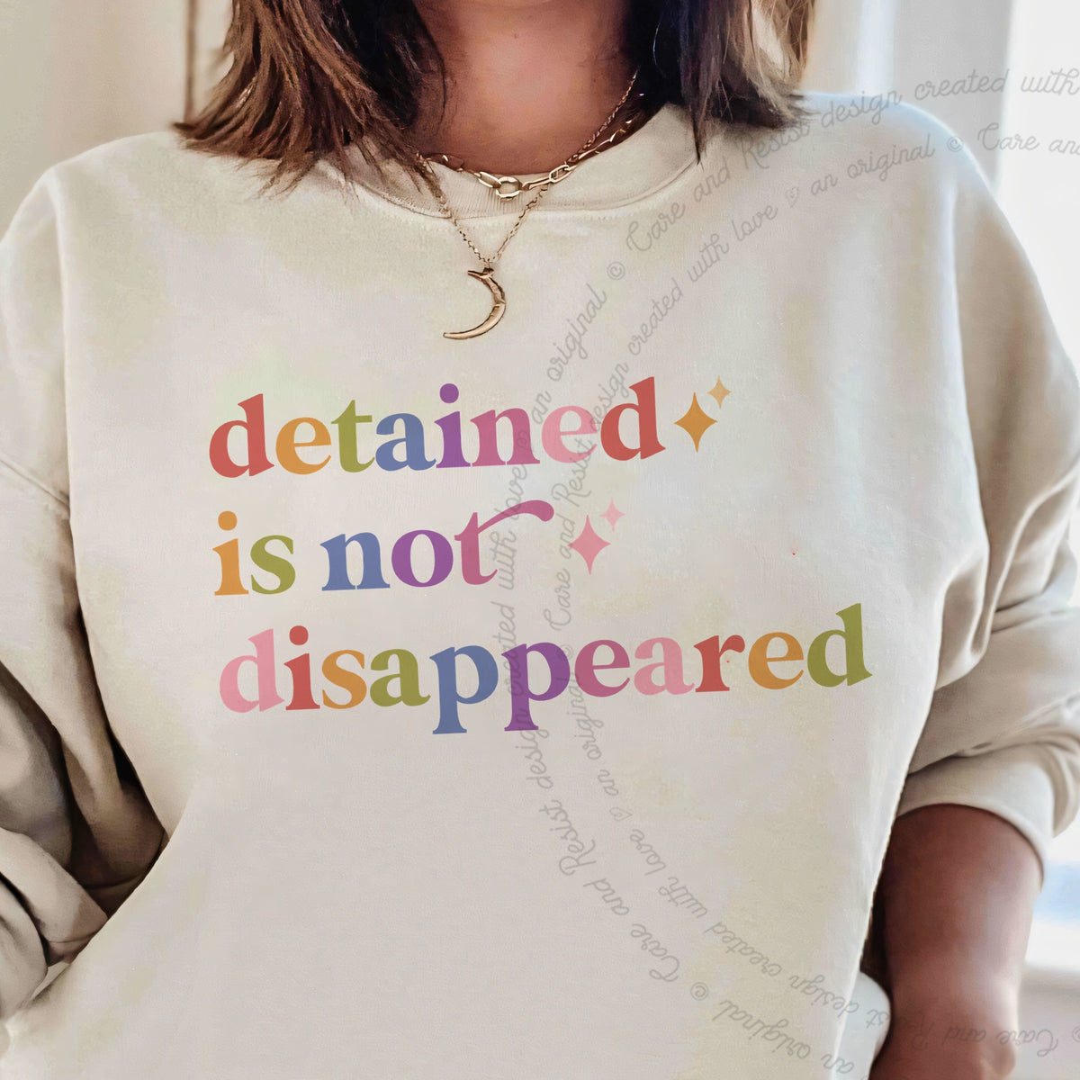 Detained is not Disappeared Care & Resist Gildan crewneck sweatshirt in Sand