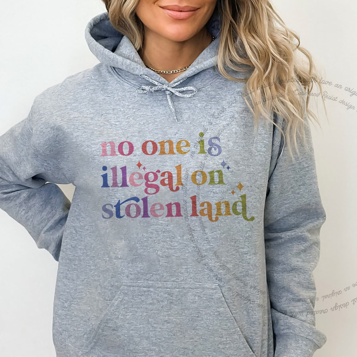 No One Is Illegal on Stolen Land Care & Resist Gildan hoodie in Sport Grey