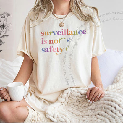 Surveillance is not Safety Care & Resist rainbow Comfort Colors tee, Ivory
