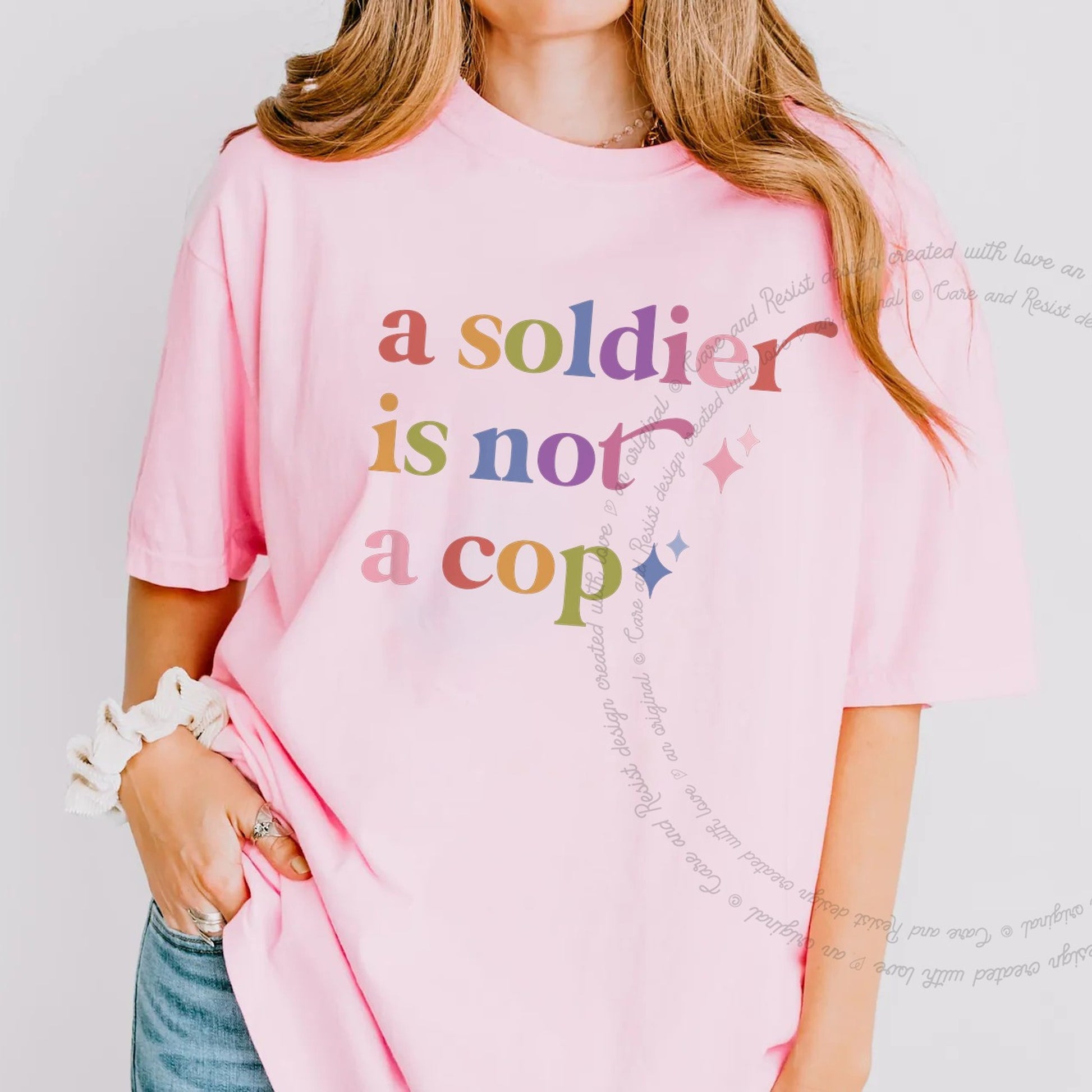 A Soldier is not a Cop Care & Resist rainbow tee