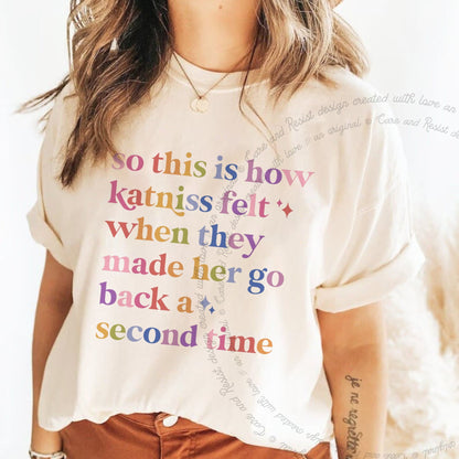 So This Is How Katniss Felt When They Made Her Go Back a Second Time Care & Resist progressive t-shirt in Ivory