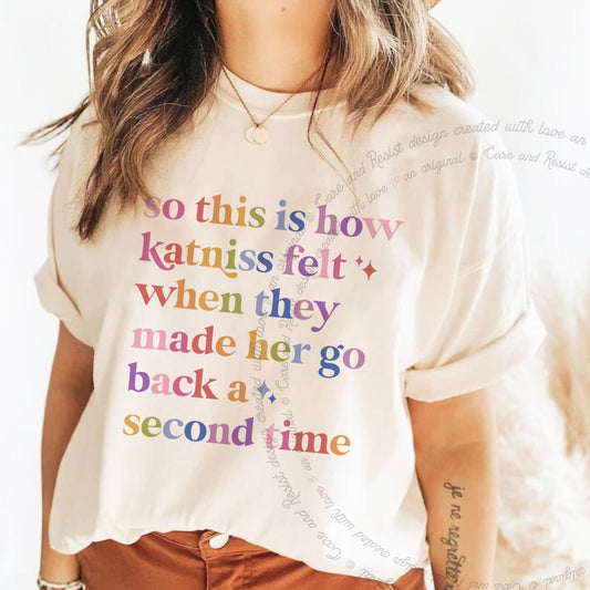 So This Is How Katniss Felt When They Made Her Go Back a Second Time Care & Resist progressive t-shirt in Ivory