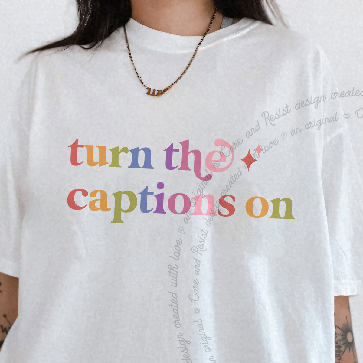 Turn the Captions on Care & Resist progressive t-shirt in White