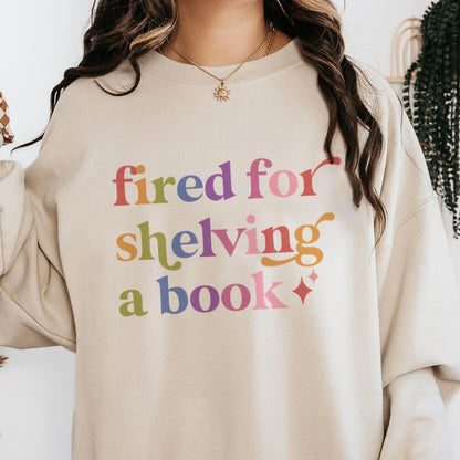 Fired for Shelving a Book Care & Resist Gildan crewneck sweatshirt in Sand