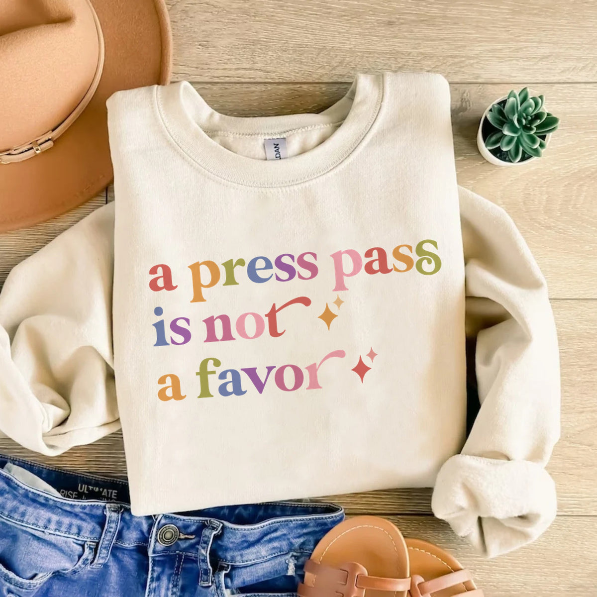 A Press Pass is not a Favor Care & Resist Gildan crewneck sweatshirt in Sand