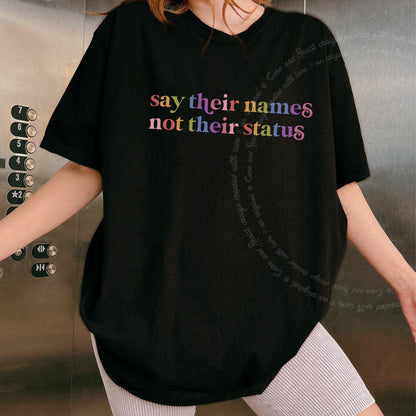Say Their Names not Their Status Care & Resist rainbow Comfort Colors tee, Black