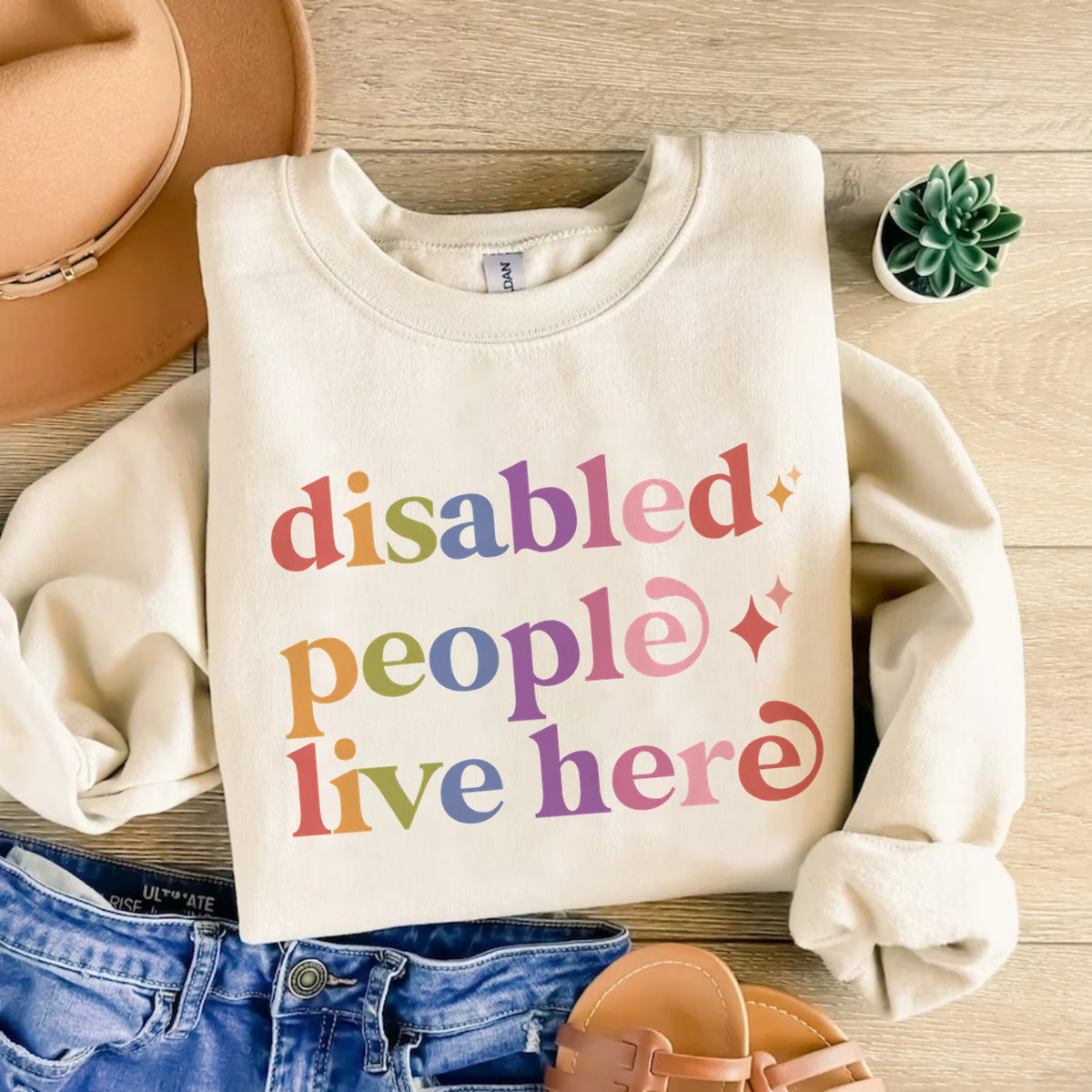 Disabled People Live Here Care & Resist Gildan crewneck sweatshirt in Sand