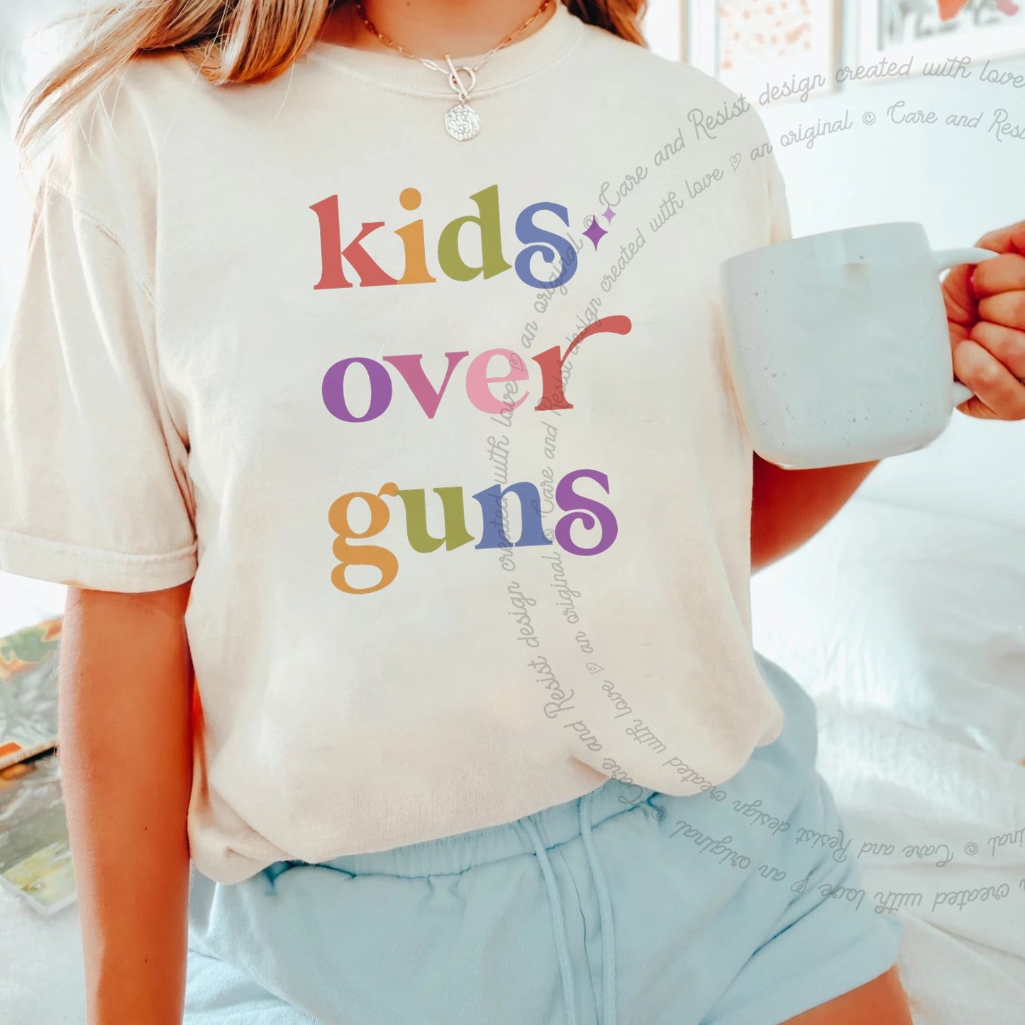Kids Over Guns Care & Resist rainbow Comfort Colors tee, Ivory