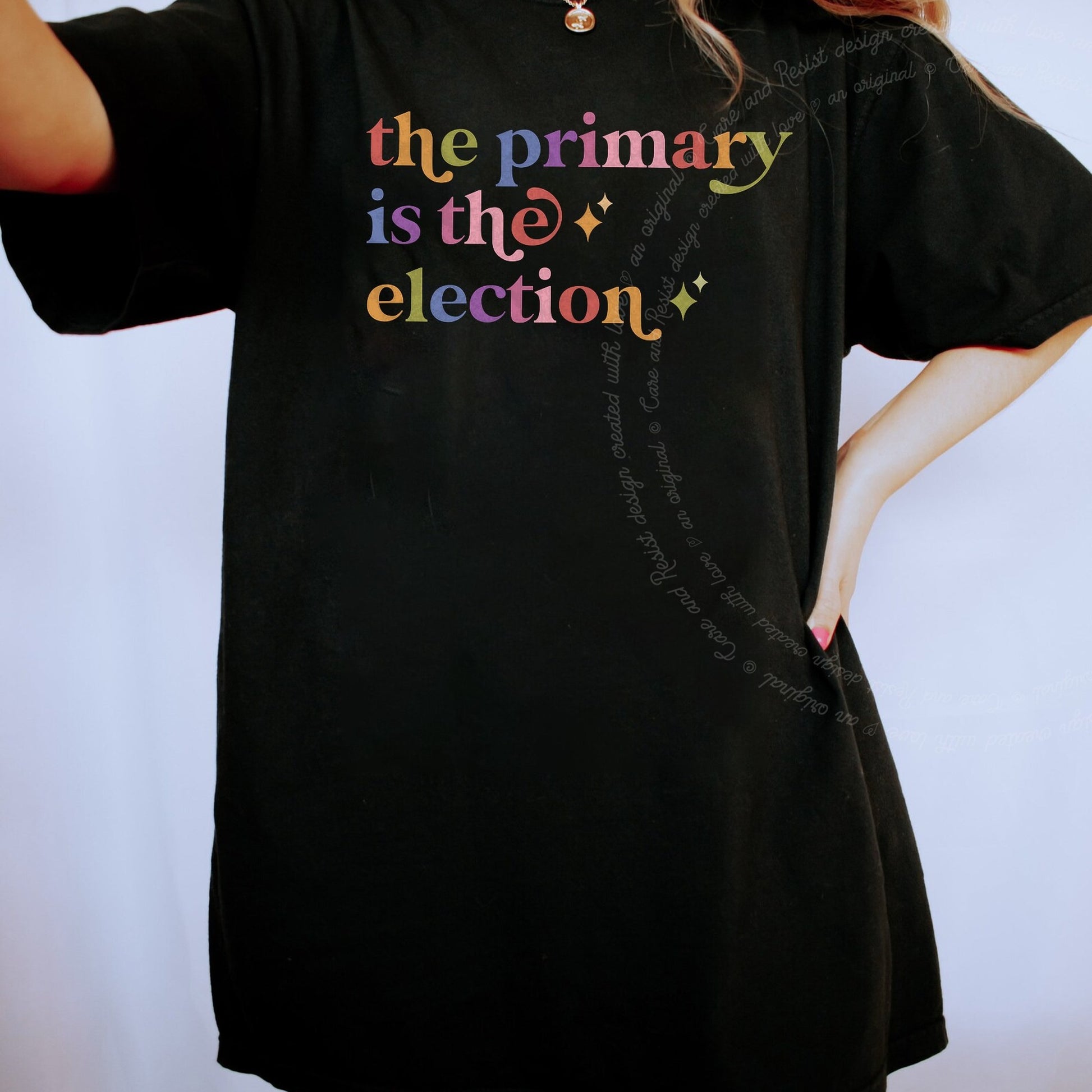 The Primary is the Election Care & Resist rainbow Comfort Colors tee, Black