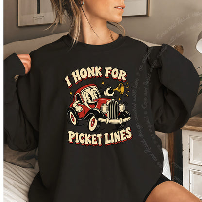 I Honk for Picket Lines Cartoon Care & Resist Gildan crewneck sweatshirt in Black