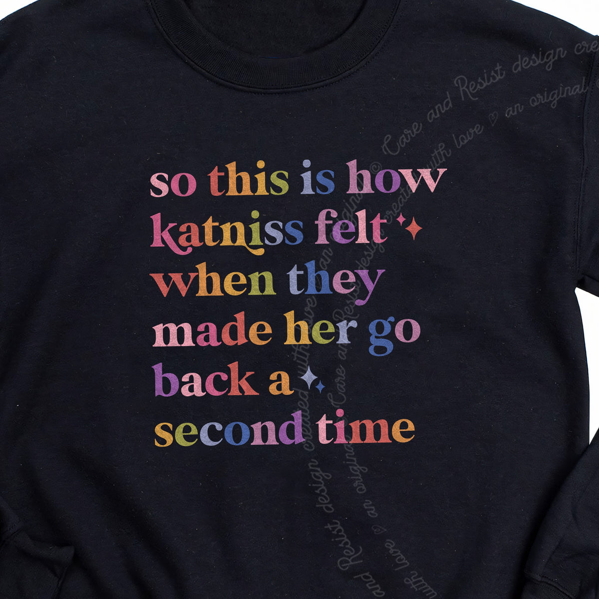 So This Is How Katniss Felt When They Made Her Go Back a Second Time Care & Resist Gildan crewneck sweatshirt in Black