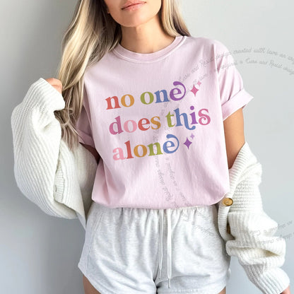No One Does This Alone Care & Resist rainbow tee
