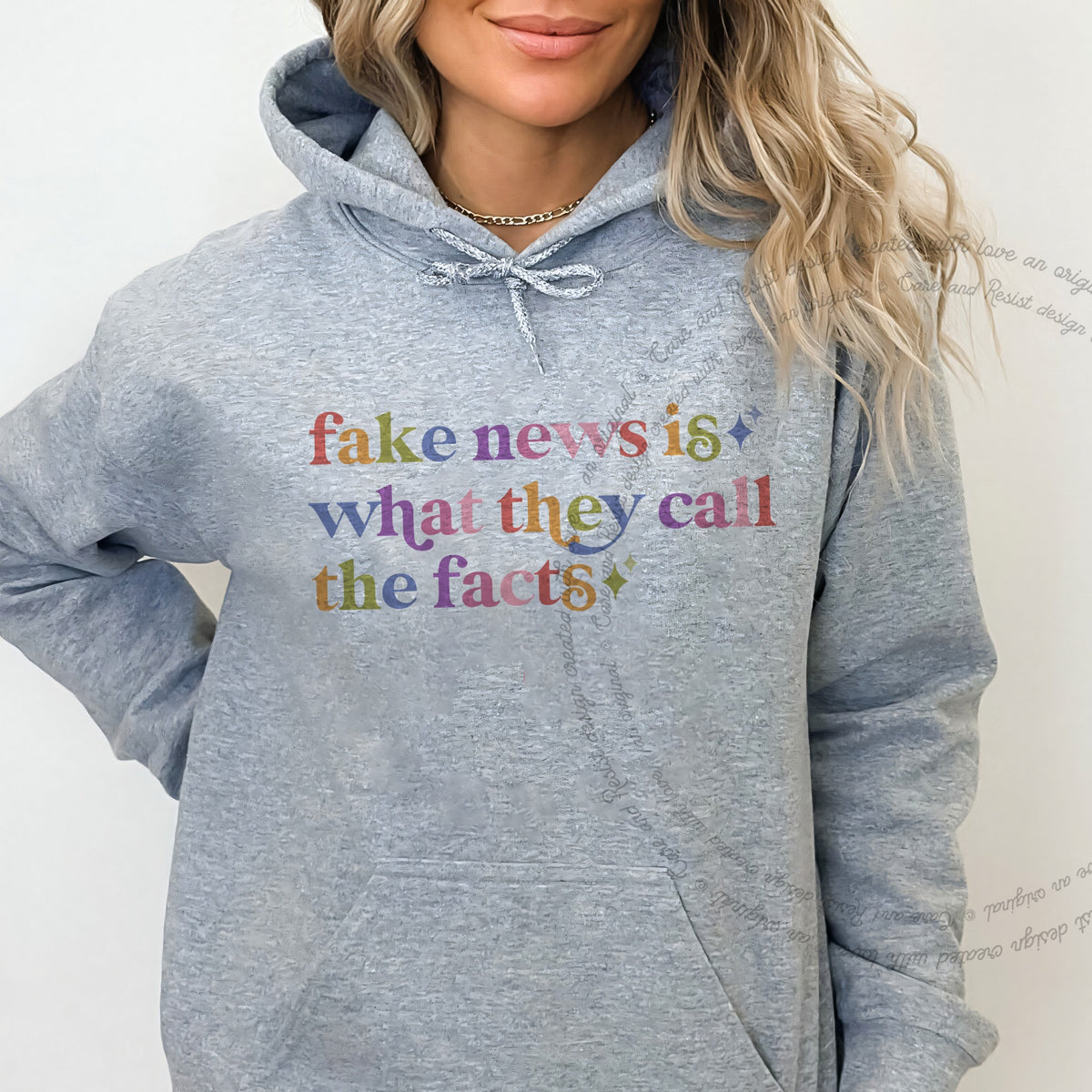 Fake News is What They Call the Facts Care & Resist Gildan hoodie in Sport Grey
