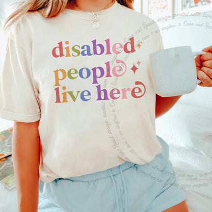 Disabled People Live Here Care & Resist rainbow tee