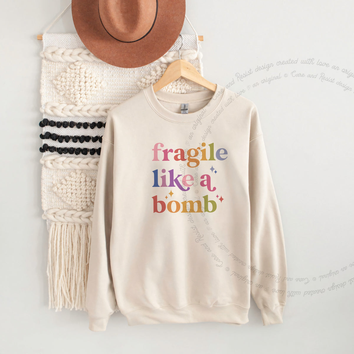 Fragile Like a Bomb Care & Resist Gildan crewneck sweatshirt in Sand