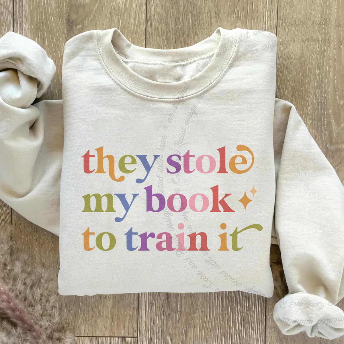 They Stole My Book to Train It Care & Resist Gildan crewneck sweatshirt in Sand
