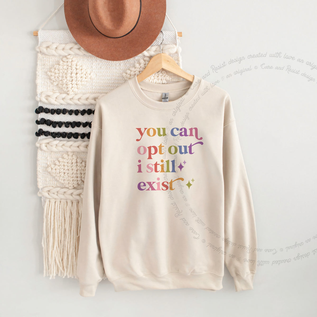 You Can Opt Out I Still Exist Care & Resist Gildan crewneck sweatshirt in Sand