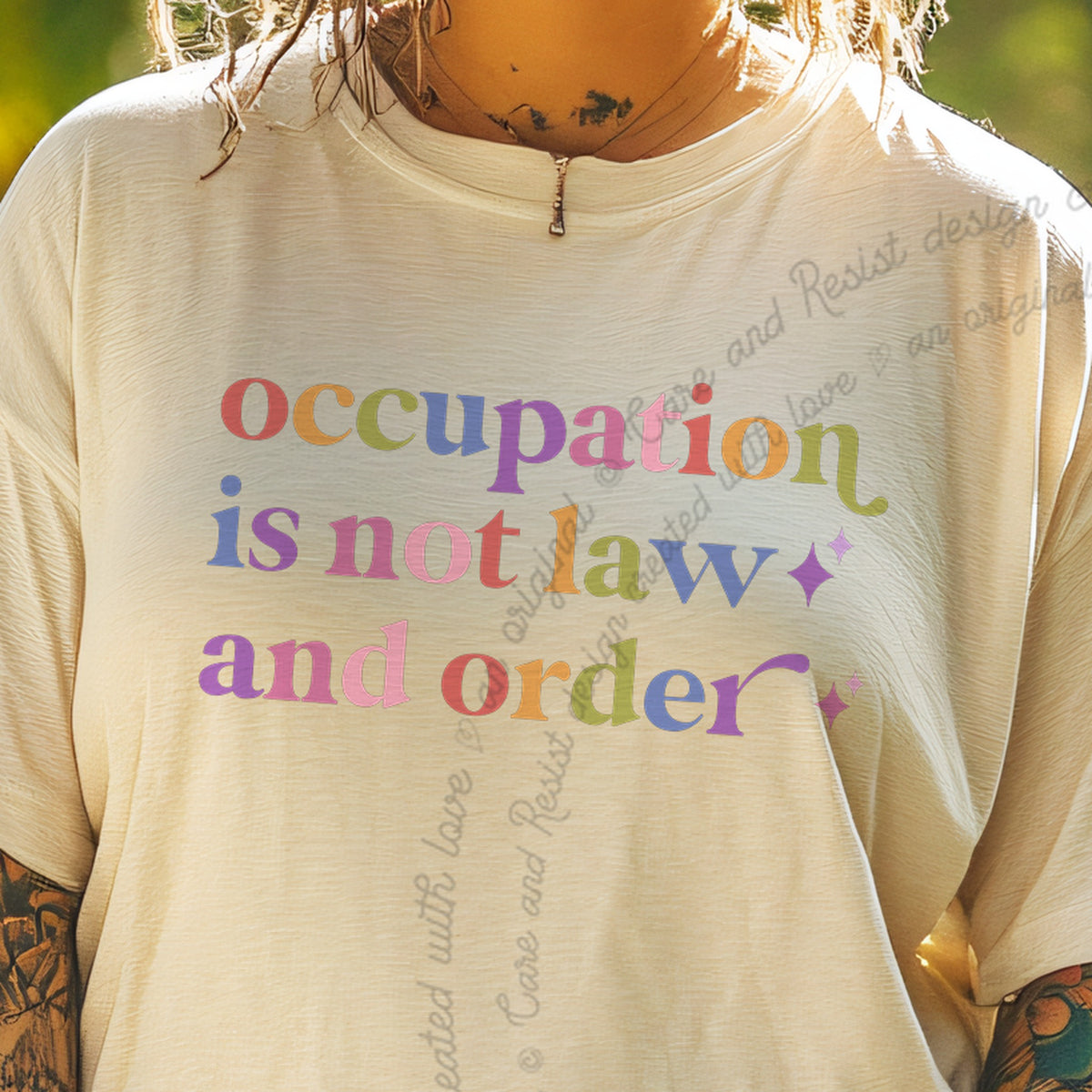 Occupation is not Law and Order Care & Resist progressive t-shirt in Ivory
