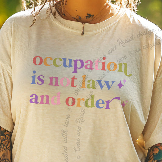 Occupation is not Law and Order Care & Resist progressive t-shirt in Ivory