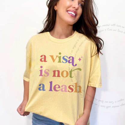 A Visa is not a Leash Care & Resist rainbow Comfort Colors tee, Banana