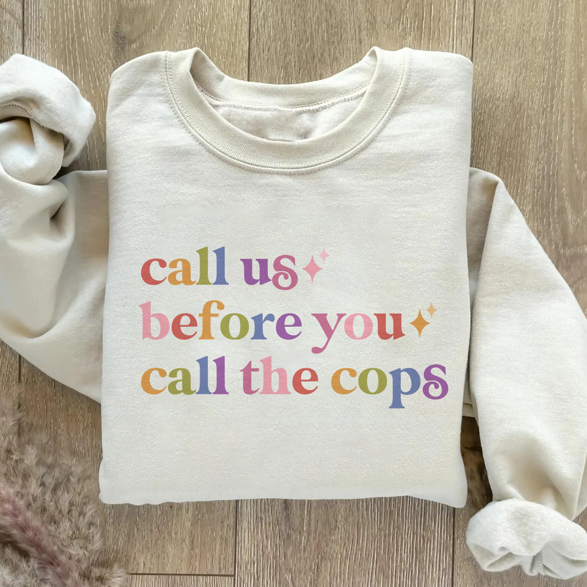 Call Us Before You Call the Cops Care & Resist Gildan crewneck sweatshirt in Sand
