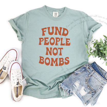 Fund People not Bombs Stacked Care & Resist progressive t-shirt in Bay